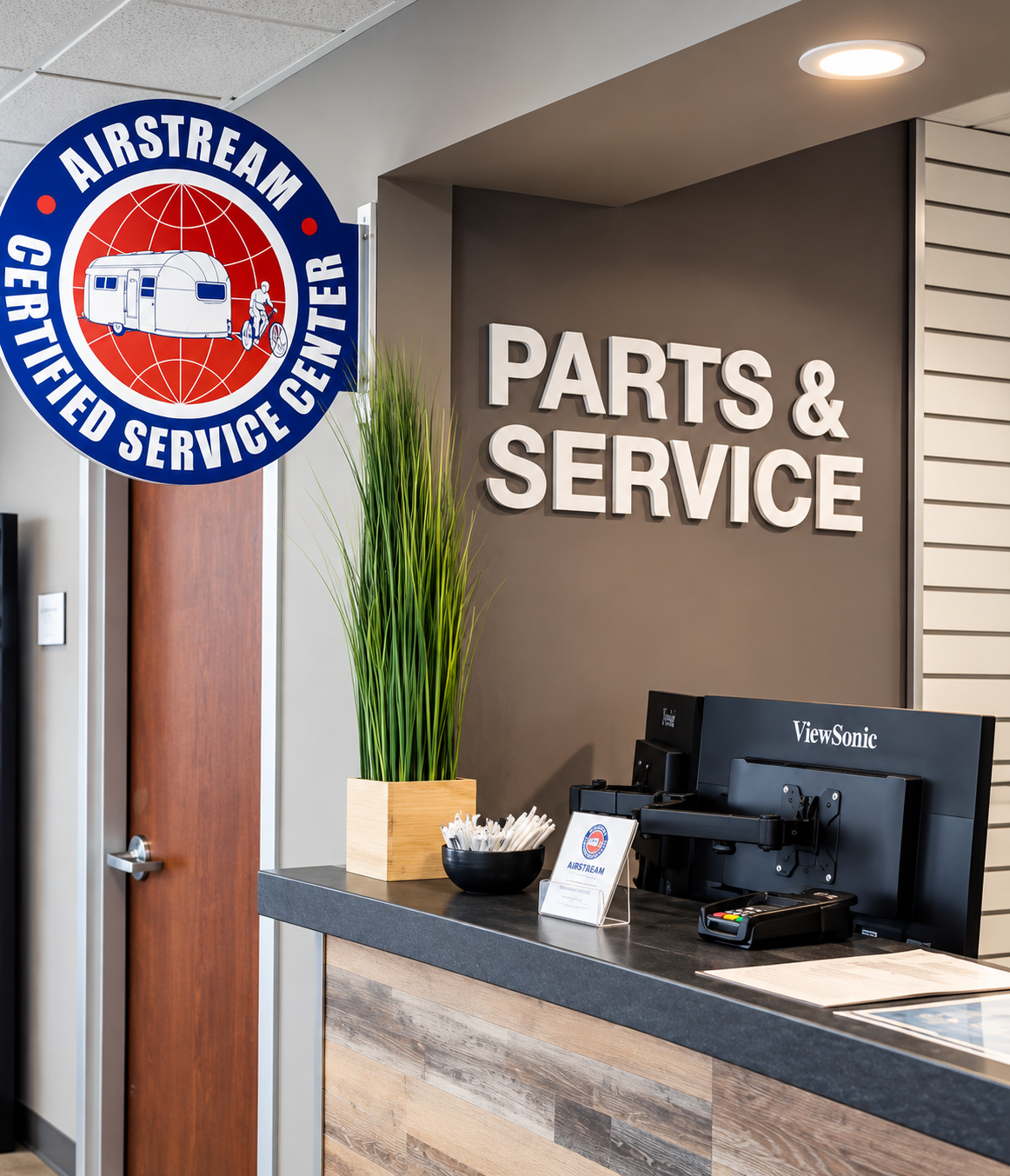 Dimensional Parts & Service lettering and Airstream Certified Service Center sign on a reception wall