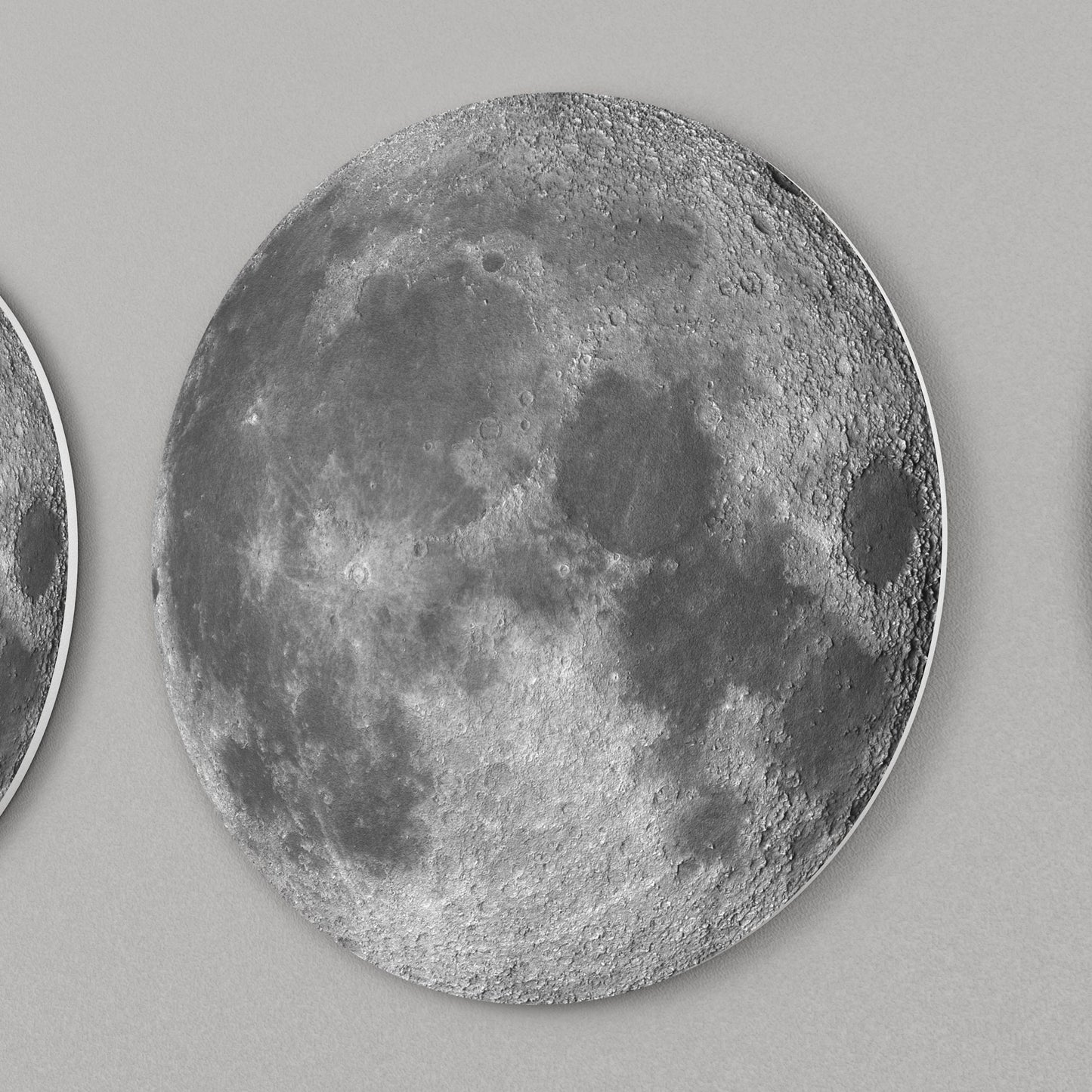lose-up of moon phase wall decor showing detailed lunar surface and layered 3D design